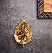 Brass Baby Krishna on Pipal Leaf Statue